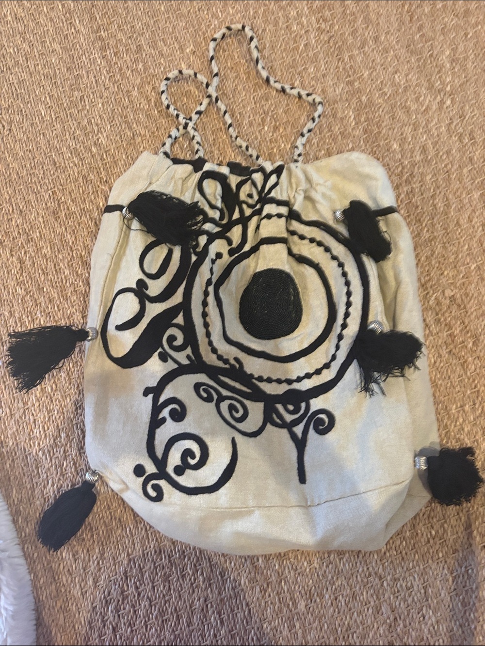 Cream Drawstring Shoulder Bag with Black Embroidered Motif